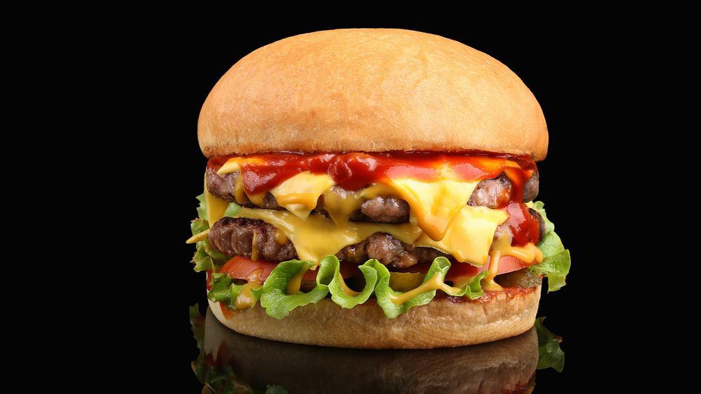 Double Cheeseburger · Two juicy beef patties, melted cheese, lettuce, tomatoes, pickles, onions, ketchup, and mustard on a sesame seed bun.