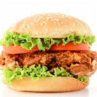 Crispy Chicken Burger · Fried chicken breast, melted cheese, lettuce, tomatoes, pickles, onions, ketchup, and mustar...