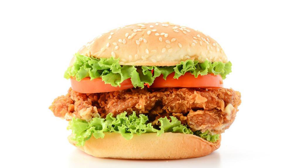 Crispy Chicken Burger · Fried chicken breast, melted cheese, lettuce, tomatoes, pickles, onions, ketchup, and mustard on a sesame seed bun.