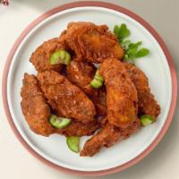 Chix Wings · Fresh chicken wings breaded, fried until golden brown, and tossed in  Hot Sauce.