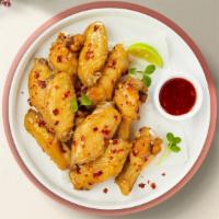 Sweet And Fiery Wings · Fresh chicken wings breaded, fried until golden brown, and tossed in sweet chili sauce.