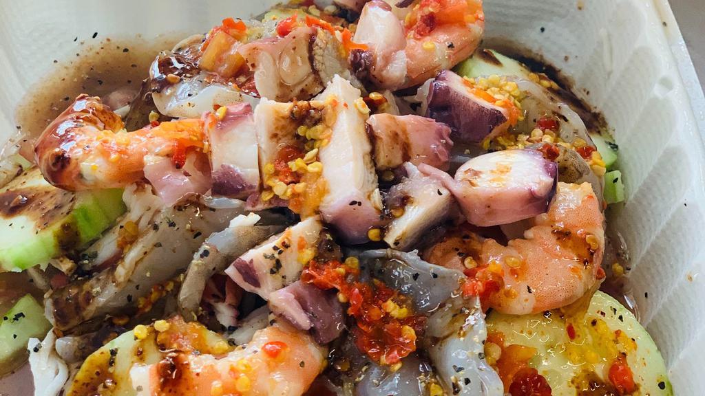 La Culichi · Tostada gigante con ceviche de camarón, jaiba, pepino, camarón crudo y cocido y pulpo / Big tostada with shrimp ceviche, imitation crab, raw and cook shrimp and octopus.