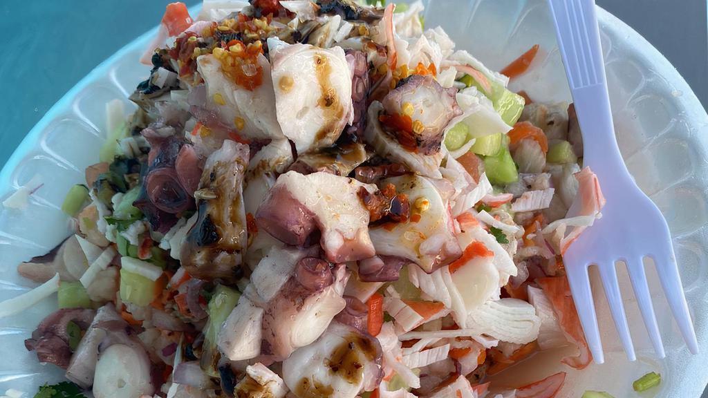 701 · Ceviche de pescado, ceviche de camarón, jaiba y popo / Fish and shrimp ceviche, imitation crab and octopus.