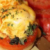 Genovese Benedict · Vegetarian. Grilled tomatoes, basil & goat cheese.