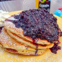 Blueberry Explosion Pancakes · Fresh blueberries inside & warm house-made compote on top, dusted with powdered sugar.