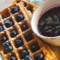 Crumbs Blueberry Waffle · Topped w/fresh blueberries, dusted w/powdered sugar & served w/warm house-made compote on th...