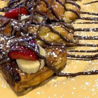 Nutella French Toast · 4 pieces of brioche, Nutella, strawberries, bananas & whipped cream.