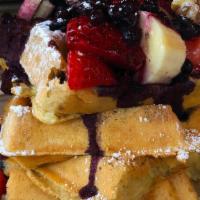 Blueberry Explosion GF Waffle · Giant Belgian Waffle halved, walnuts, fresh blueberries, strawberries & bananas, dusted with...