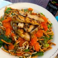 Chinese Chicken Salad · Marinated chicken breast, chopped romaine & cilantro topped with sliced almonds, mandarin or...