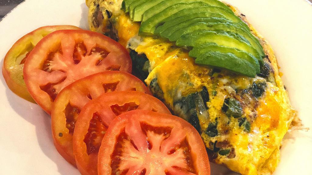 Keto Crumbs & All Omelet · Applewood smoked bacon, rosemary ground chuck, Italian sausage, linguiça, cheddar, avocado, sautéed mushrooms, spinach, peppers, tomatoes & onions. Served with choice of sliced tomatoes or green salad.