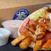 e. Shrimp Pita Wrap · Seasoned shrimps with greek spice mix, served on a warm pita bread filled with fries, tomato...
