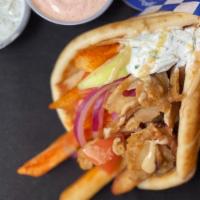 d. Fish Pita Wrap · Seasoned fish with greek spice mix, served on a warm pita bread filled with fries, tomatoes,...
