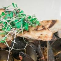 Mussels · Fresh Mussels with andouille, shallots, tomato broth, grilled toast