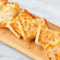  Cheesy Garlic Bread · Melted Mozzarella,  sharp Cheddar and  Parmesan top a split toasted Ciabatta roll spread wit...
