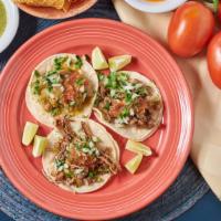 Regular Tacos · Choice of meat, cilantro, onions & salsa
