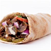 The Lamb Shawarma Wrap · Fresh marinated lamb with spices wrapped in lavash bread and topped with customer's choice o...