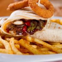 Combo Shawarma Wrap with Fries · Sizzling marinated chicken and lamb shawarma topped potato fries and customer's choice of ad...