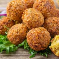 Falafel · Golden, deep-fried fritters made from ground chickpeas, herbs and spices.