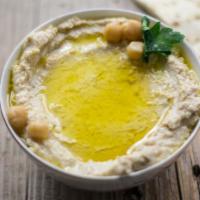 Side of Hummus · Classic Mediterranean dish made with mashed chickpeas blended with tahini, lemon juice, and ...