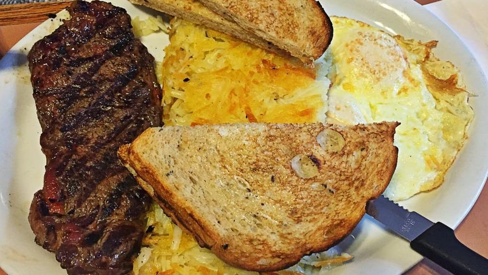Ultimate Steak & Eggs Breakfast Only · An aged six oz seasoned, juicy NY steak & two extra large eggs, served with country potatoes or ev's hash browns & your choice of toast.