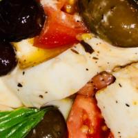 Caprese Salad · Fresh mozzarella, fresh tomatoes, ascolane olives, basil.