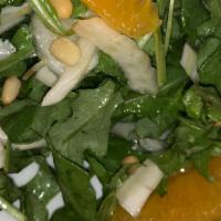 Caprioli Salad · Fennel, arugula, orange, roasted pine nuts with orange infused vinaigrette.