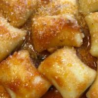 Gnocchi Sorrentina · Homemade potato dumplings in tomato basil sauce & burrata cheese.