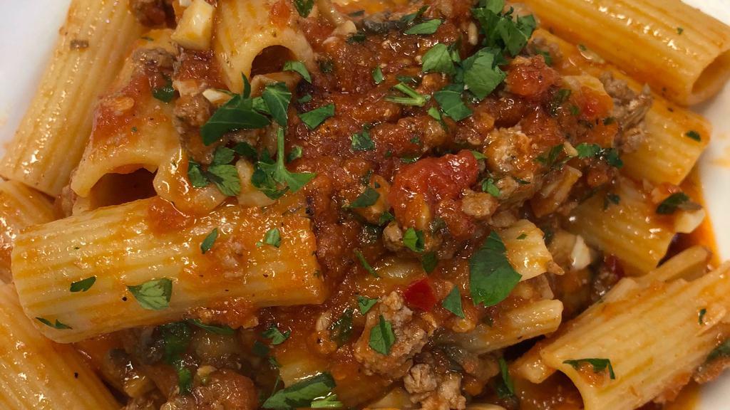 Rigatoni Paestum · tube pasta with homemade sausage, mushrooms, fresh chili in red sauce (spicy)