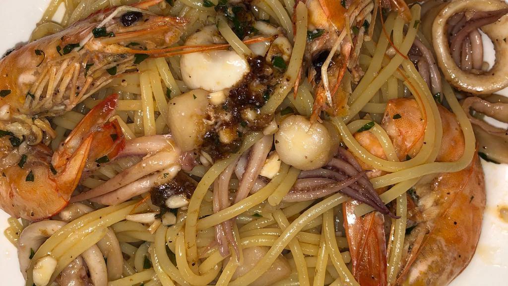 Spaghetti Allo Scoglio · Shrimp, calamari, scallops in white wine sauce.