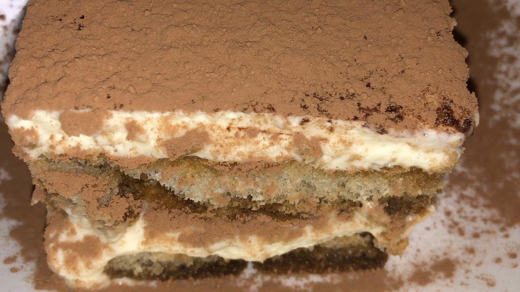 Tiramisu · Lady finger cookies soaked in espresso, layered in creamed mascarpone cheese & creamed eggs, dusted with cocoa powder