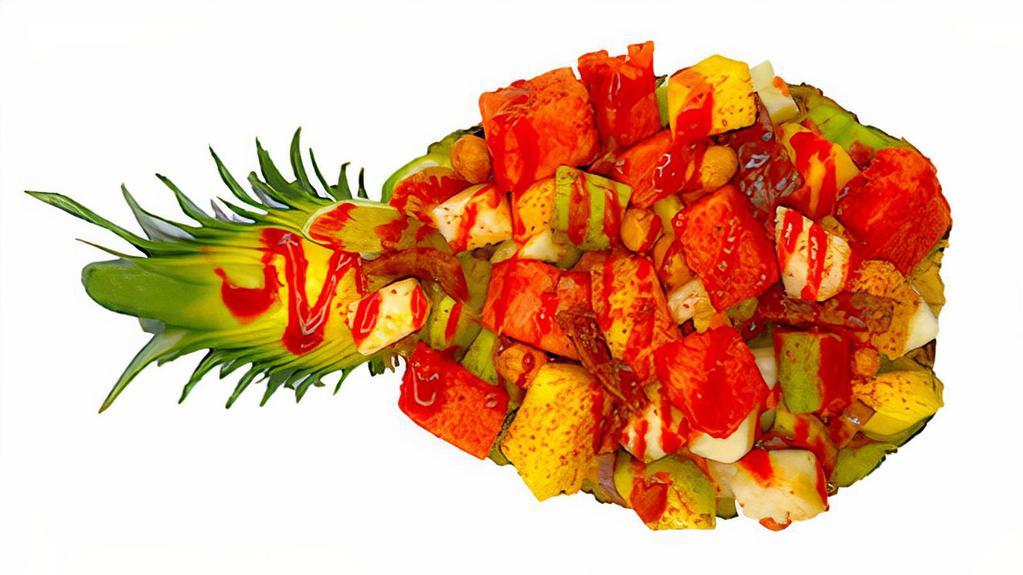 Piña Loka · pineapple, watermelon, cucumber, jicama, mango, crunchy peanuts, tamarind candy, lime, chamoy, hot sauce, tajin, served in pineapple shell