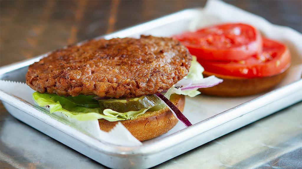 Beyond Burger · Plant based burger by Beyond
served on a brioche  bun  with butter lettuce, fresh pickles and our grape tomato jam.