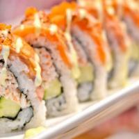 49er · Crab meat, shrimp tempura, topped with salmon and tobiko.