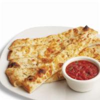 Parmesan Flatbread Sticks · Baked pizza dough topped with garlic butter and Parmesan cheese, served with house-made mari...