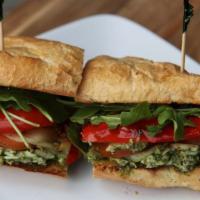 Chicken Pesto Sandwich · Chicken breast, provolone, tomato, red peppers, arugula, mayo, and pesto on toasted baguette.