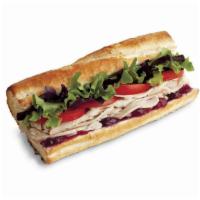 Turkey Sandwich · Hand sliced all natural oven roasted turkey, Provolone, cranberry sauce, mixed greens, roma ...