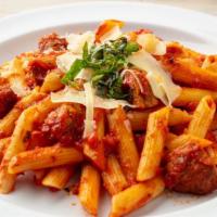Meaty Pasta · Penne pasta, house-made marinara, meatballs, shaved parmesan, fresh basil.