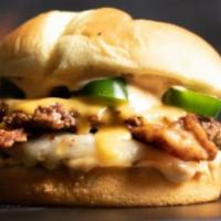 Texas Fiery Burger · Halal burger with pickles, onions, jalapeños, cheese, and BBQ Sauce