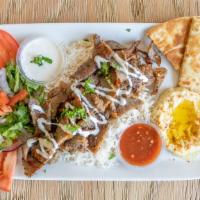 Gyro Platter  · Gyro meat served on a bed of rice, hummus, salad, pita bread with SAM's Tzatziki sauce.