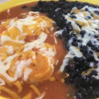 Huevos Rancheros · Two eggs on a corn tortilla, cheese, and our tasty homemade ranchera sauce. Served all day. ...