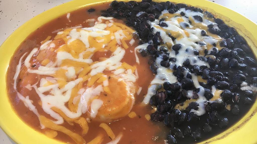 Huevos Rancheros · Two eggs on a corn tortilla, cheese, and our tasty homemade ranchera sauce. Served all day. Breakfasts are served with choice of one side order rice, breakfast potatoes, hash browns, or beans. Also included tortillas or toast. Breakfast is not included with chips.