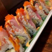 Giant Roll · Shrimp tempura, spicy tuna topped with imitation crab meat, yellow tail, salmon, tuna, eel w...