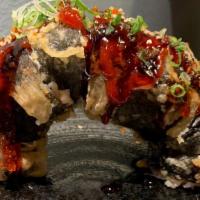 Arch Roll · Deep fried spicy tuna and cream cheese topped with tobiko, scallion and house special sauce.
