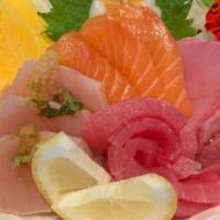 Chirashi · fifteen small pieces of sashimi over sushi rice.