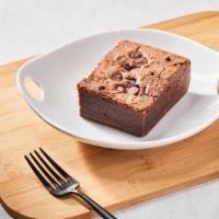 Fudgy Brownie by Homeroom · By Homeroom. A delicious, freshly baked, dark chocolate chunk brownie. Contains dairy and eg...