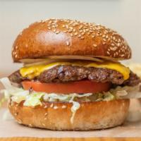 Cheeseburger · 100% grass feed beef served on a locally baked sesame seed bun with lettuce, tomato, onion a...