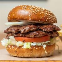 Double Hamburger · 100% grass feed beef served on a locally baked sesame seed bun with lettuce, tomato, onion a...