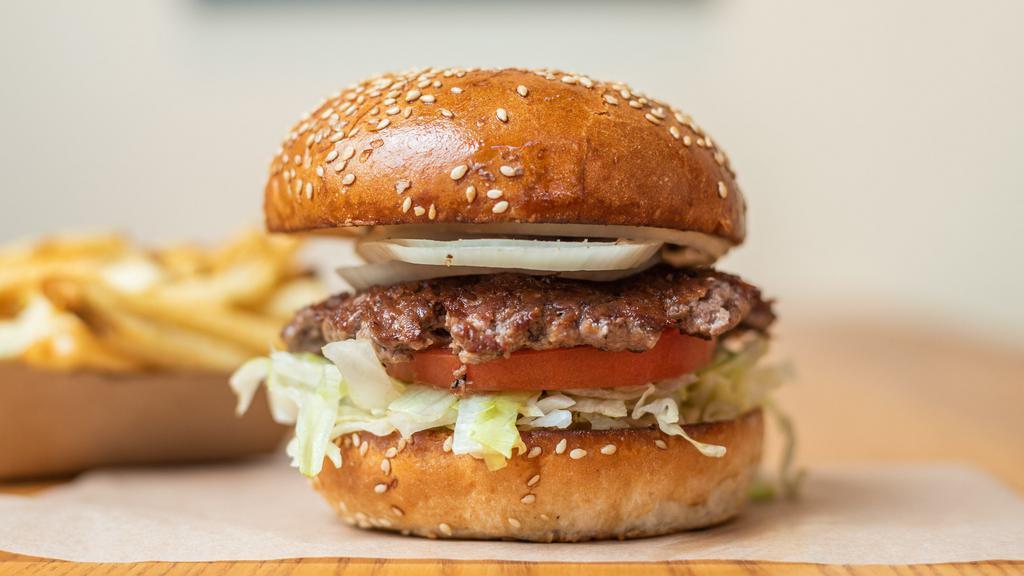 Hamburger · 100% grass feed beef served on a locally baked sesame seed bun with lettuce, tomato, onion and secret sauce.