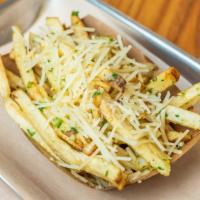 Garlic Fries · Our hand-cut fries served with our homemade garlic with extra virgin oil and parsley. Topped...
