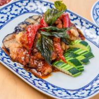 Pla Dook Tod Grob · Spicy. Double cooked crispy fillet of catfish topped with house tamarind chili sauce eggplan...